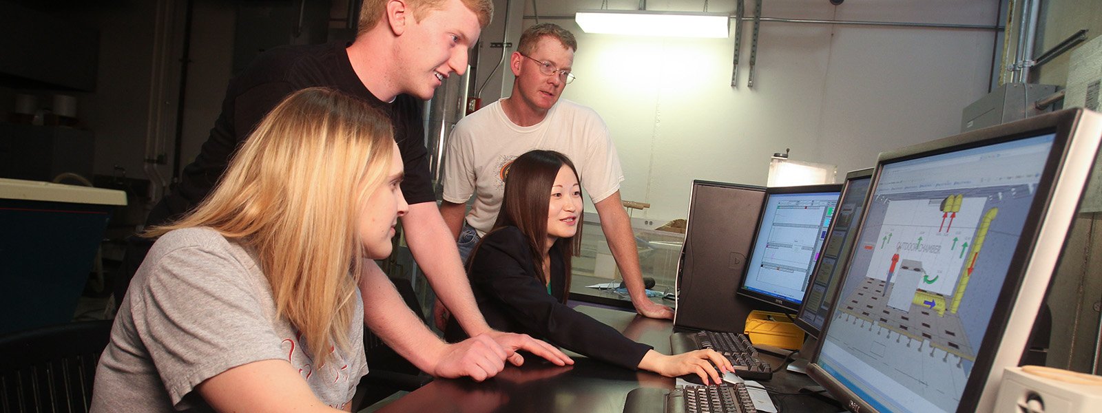 Students using computers for research studies