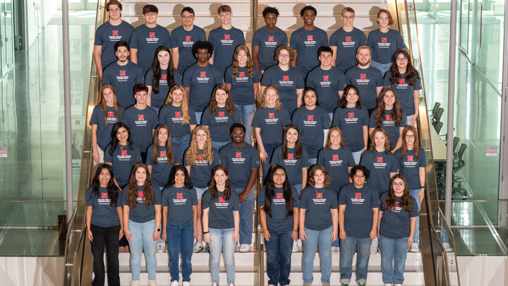 Forty first-year students, all members of the 2024-25 cohort of the Peter Kiewit Foundation Engineering Academy at Nebraska, pose on a staircase in five rows of eight people each.