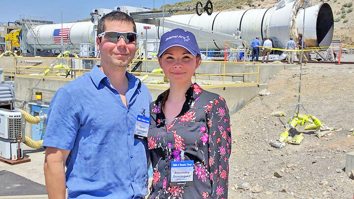 Alexandra Dominguez and her husband, Dave, stand in front of a booster rocket at the Orbital ATK test facility in Promontory, Utah. The Dominguezes attended a ground test of the Space Launch System’s five-segment solid rocket motor on June 28, 2016.