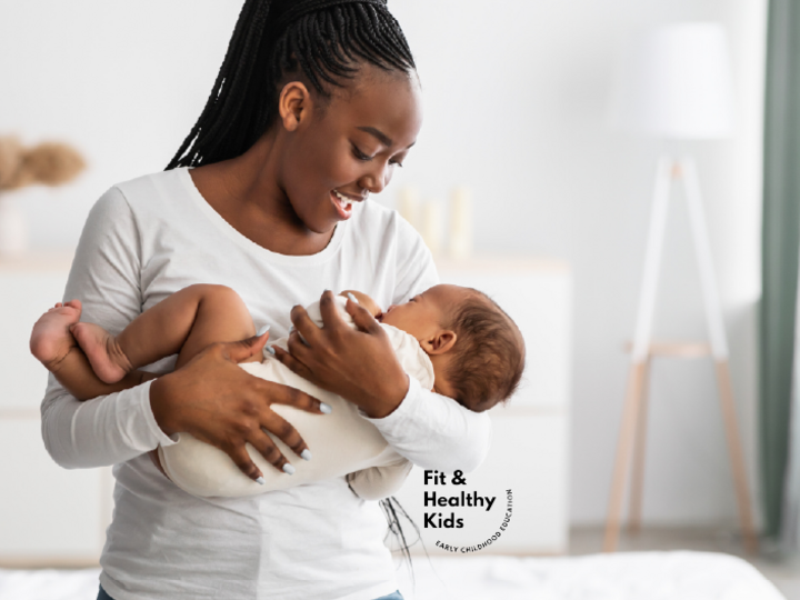 Woman cradling infant in her arms