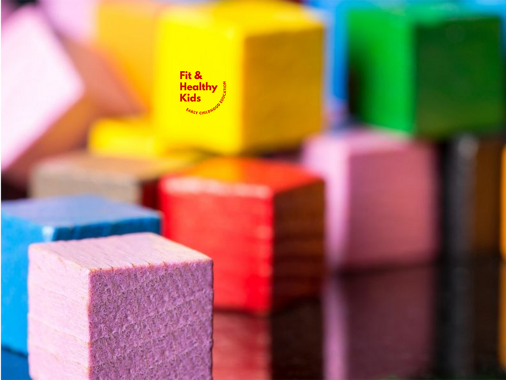 Colored wooden blocks stacked together on table