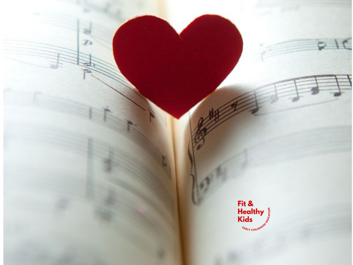 Music book with red heart resting on the page