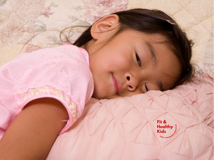 Child resting head on a pillow