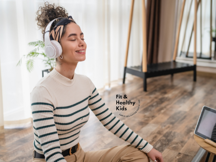 Adult woman sitting on floor with headphones 