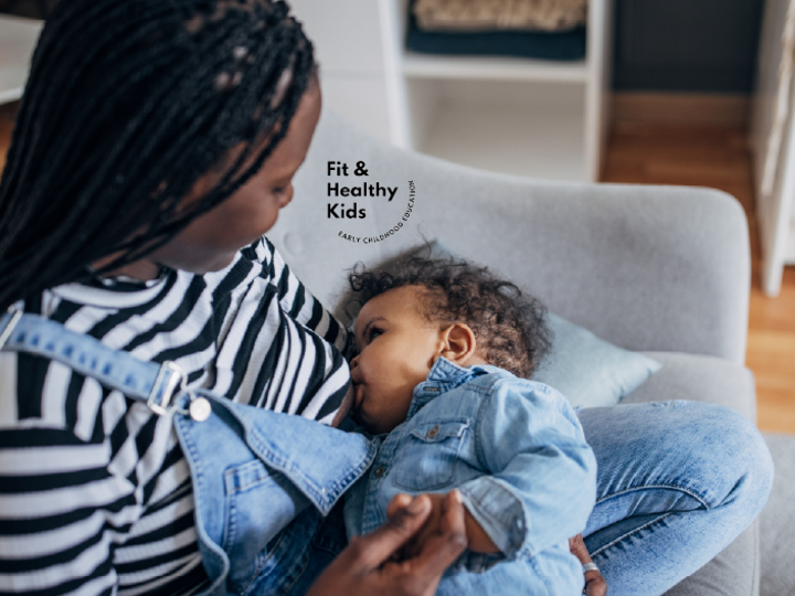 Woman sitting in chair with infant