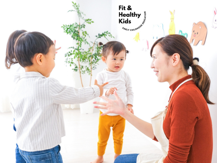 Teacher with preschoolers doing a lesson in a circle
