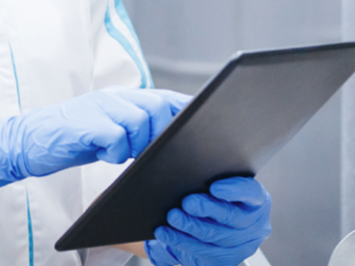 Food service worker holding tablet