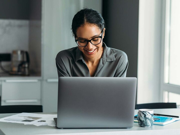 woman on laptop studying business analytics