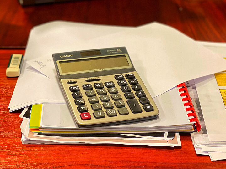 Calculator on top of papers